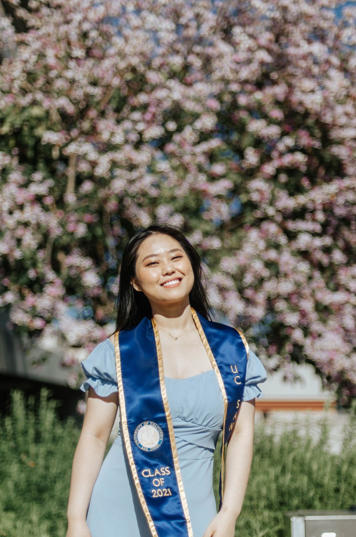 person in front of the flowers at the Price Center