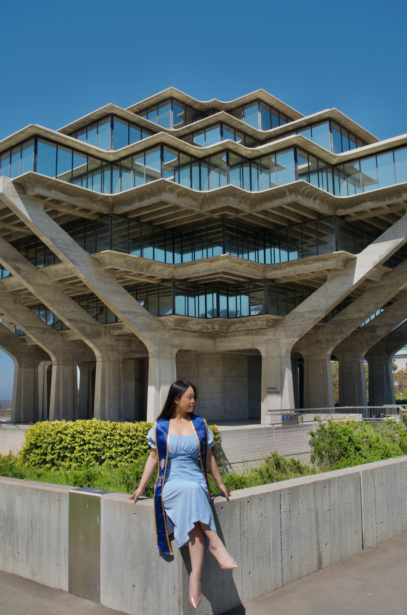 person in front of Geisel Library